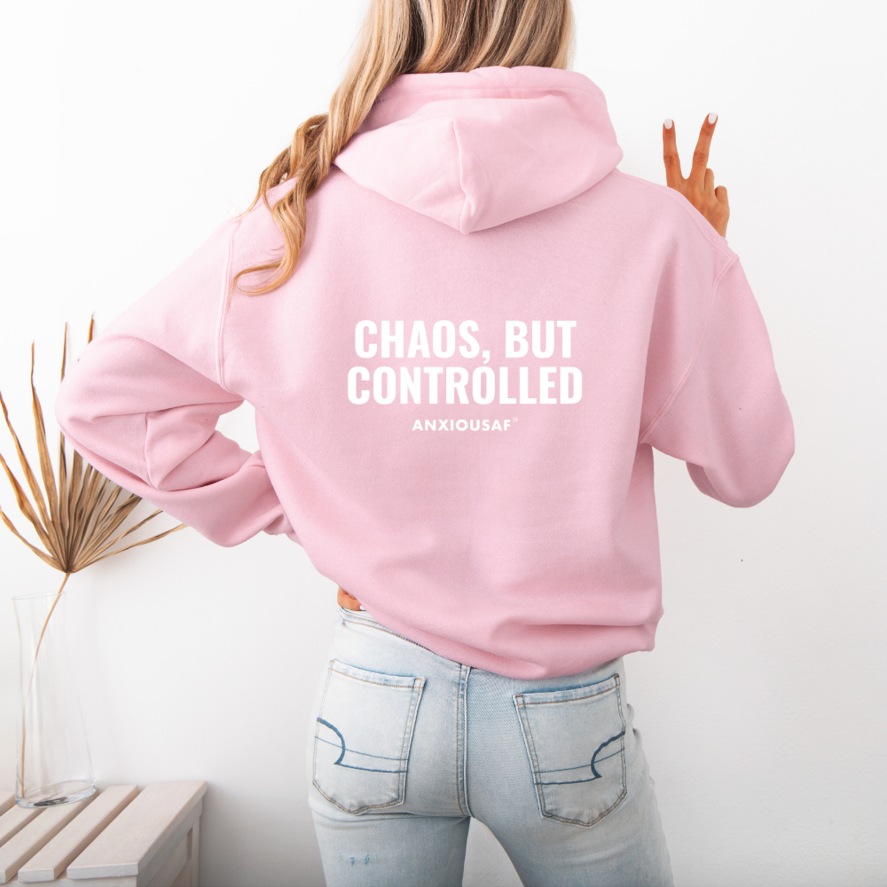 a pink hoodie with text on the back,